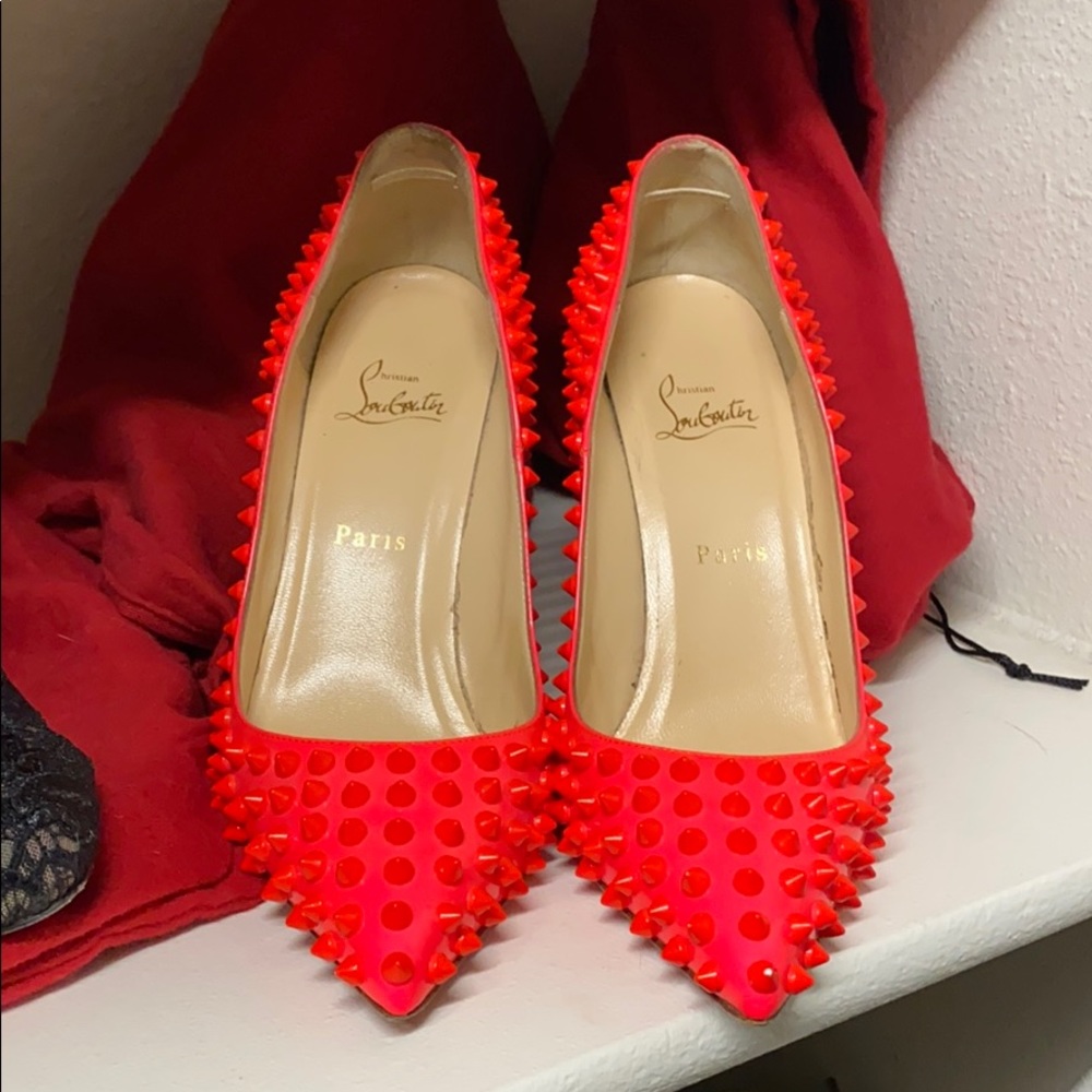 Christian Louboutin Hot pink spikes.
